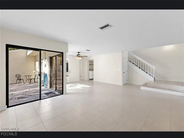 a view of an empty room with large window