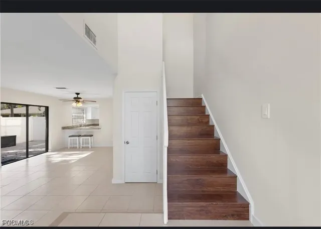 a view of a hallway with staircase