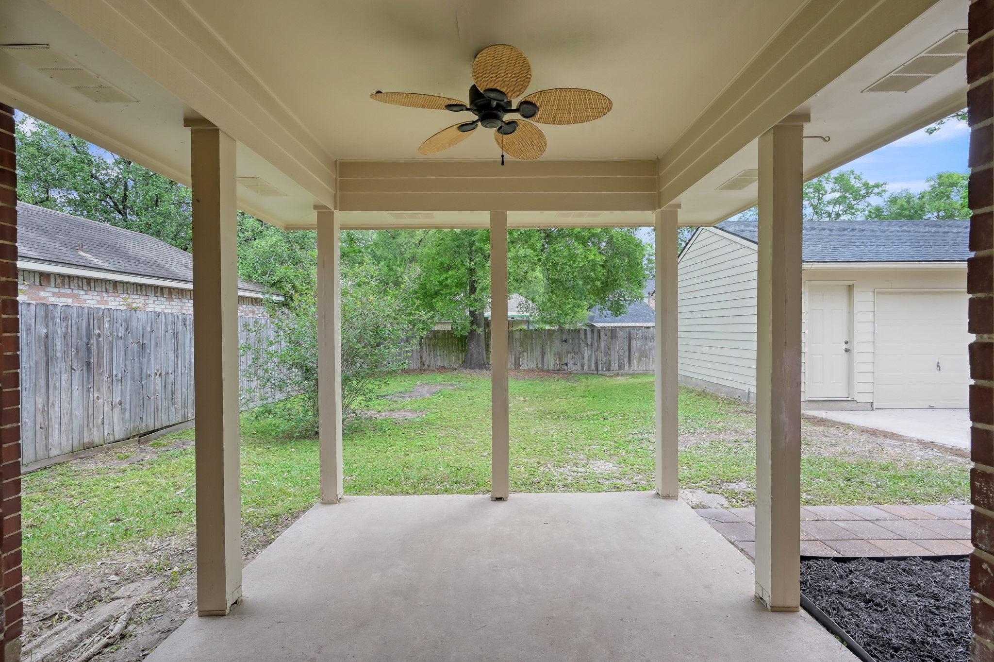 114 Regency Way Conroe, TX 77304 - Photo 40 of 48 Covered back patio leading to oversized detached garage.