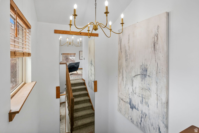 2189 Samak Park Loop, Unit 43 Kamas, UT 84036 - Photo 19 of 48 Stairway featuring a chandelier