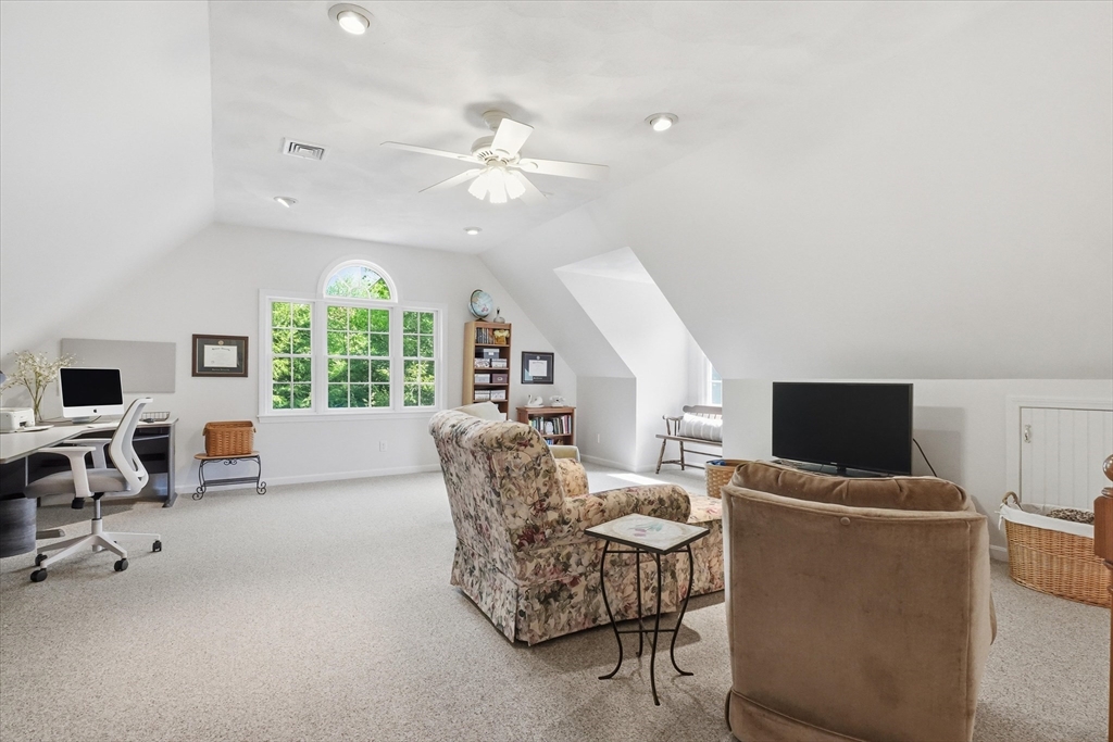 9 Fazio Farm Road Georgetown, MA 01833 - Photo 32 of 42 a living room with furniture and a flat screen tv