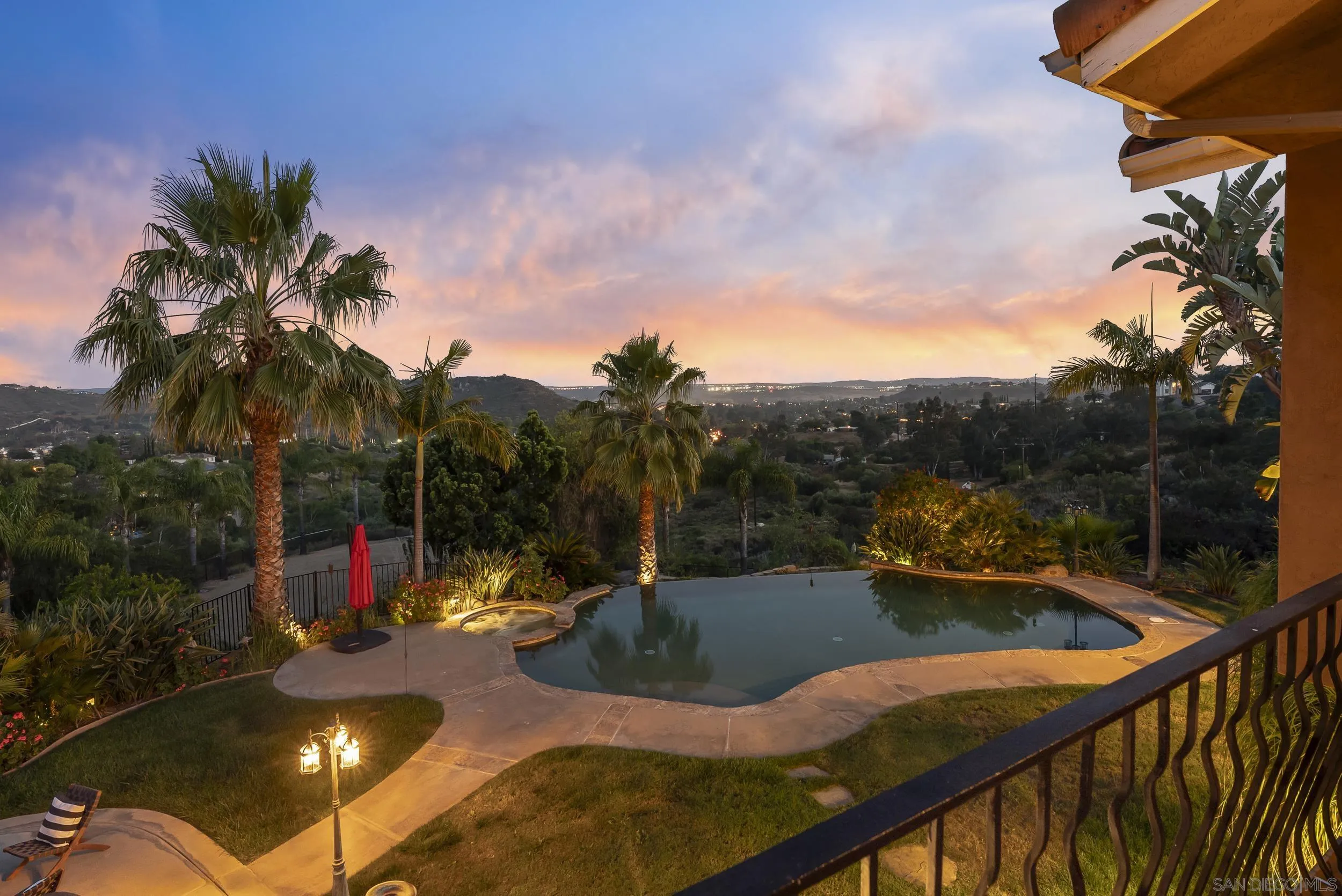 14998 Budwin Lane Poway, CA 92064 - Photo 9 of 44 a view of a swimming pool with a patio and a garden