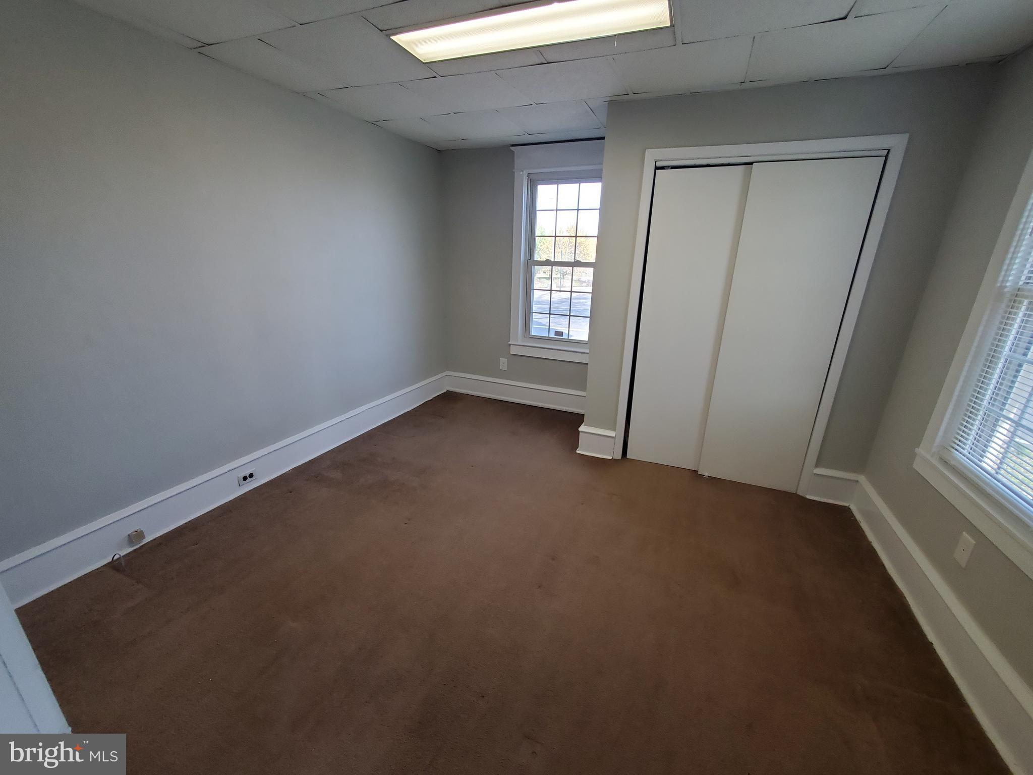 191 West Cohawkin Road, Unit A DOWNSTAIRS Clarksboro, NJ 08020 - Photo 11 of 15 an empty room with windows