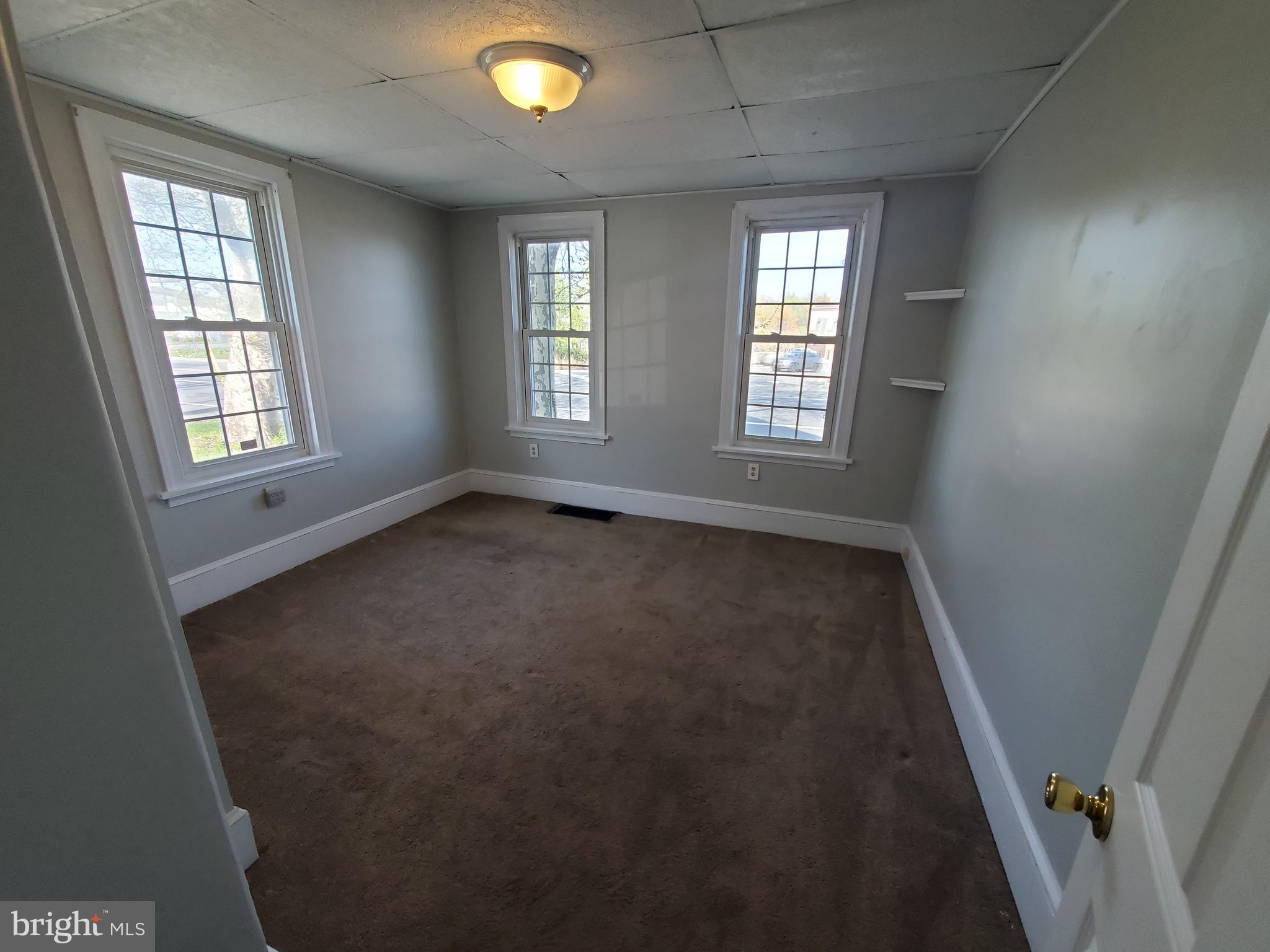 191 West Cohawkin Road, Unit A DOWNSTAIRS Clarksboro, NJ 08020 - Photo 12 of 15 an empty room with windows