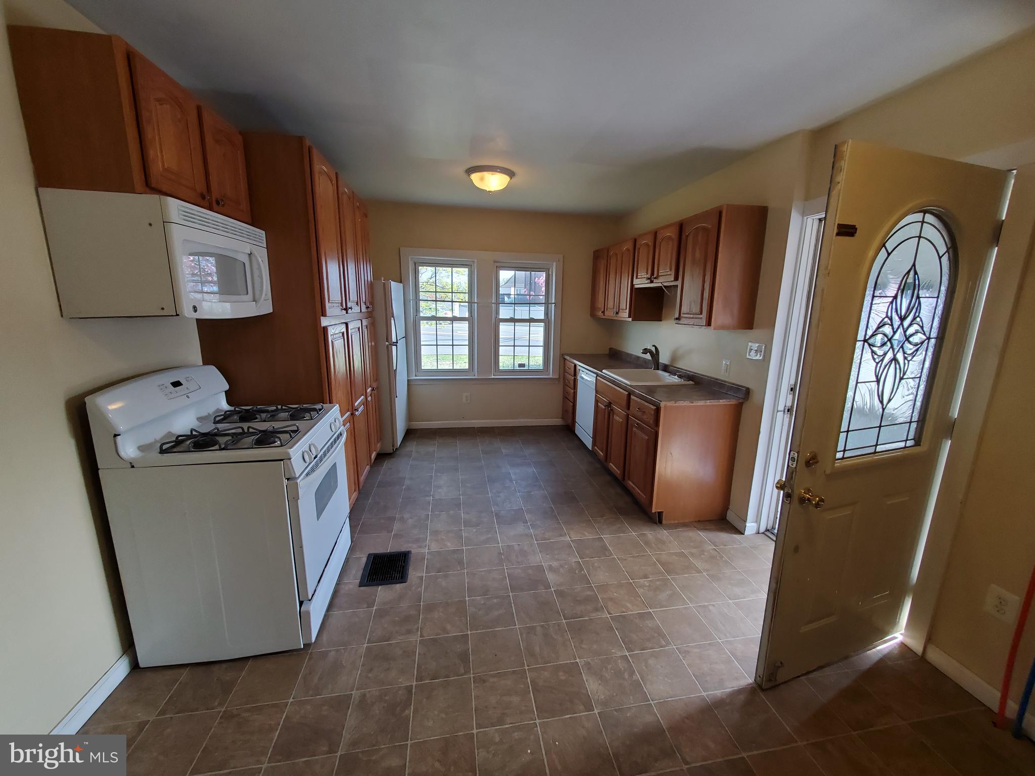 191 West Cohawkin Road, Unit A DOWNSTAIRS Clarksboro, NJ 08020 - Photo 13 of 15 a kitchen with granite countertop a stove top oven sink and cabinets