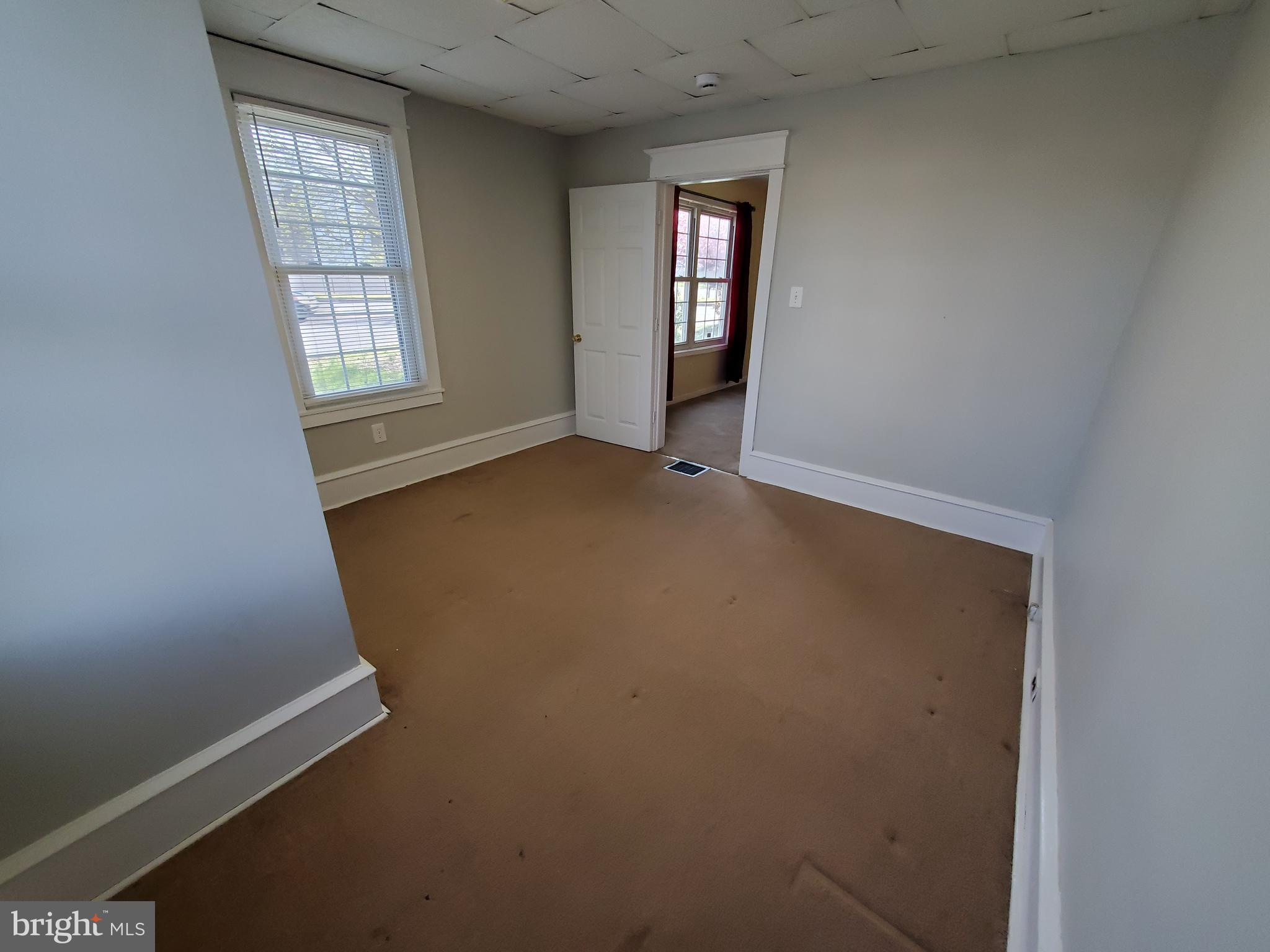 191 West Cohawkin Road, Unit A DOWNSTAIRS Clarksboro, NJ 08020 - Photo 7 of 15 an empty room with windows