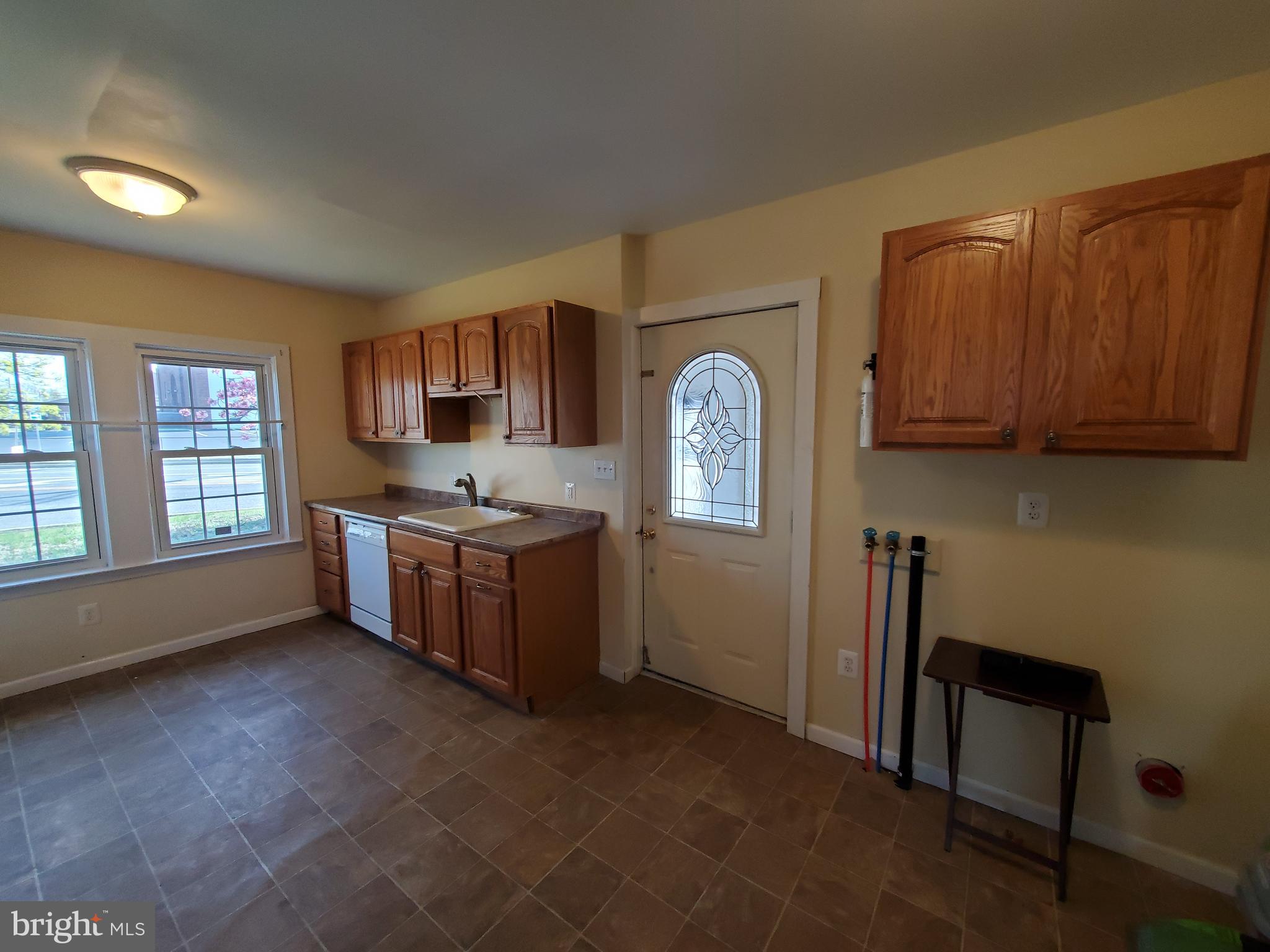 191 West Cohawkin Road, Unit A DOWNSTAIRS Clarksboro, NJ 08020 - Photo 9 of 15 a kitchen with stainless steel appliances granite countertop a stove a sink dishwasher and a refrigerator with wooden cabinets