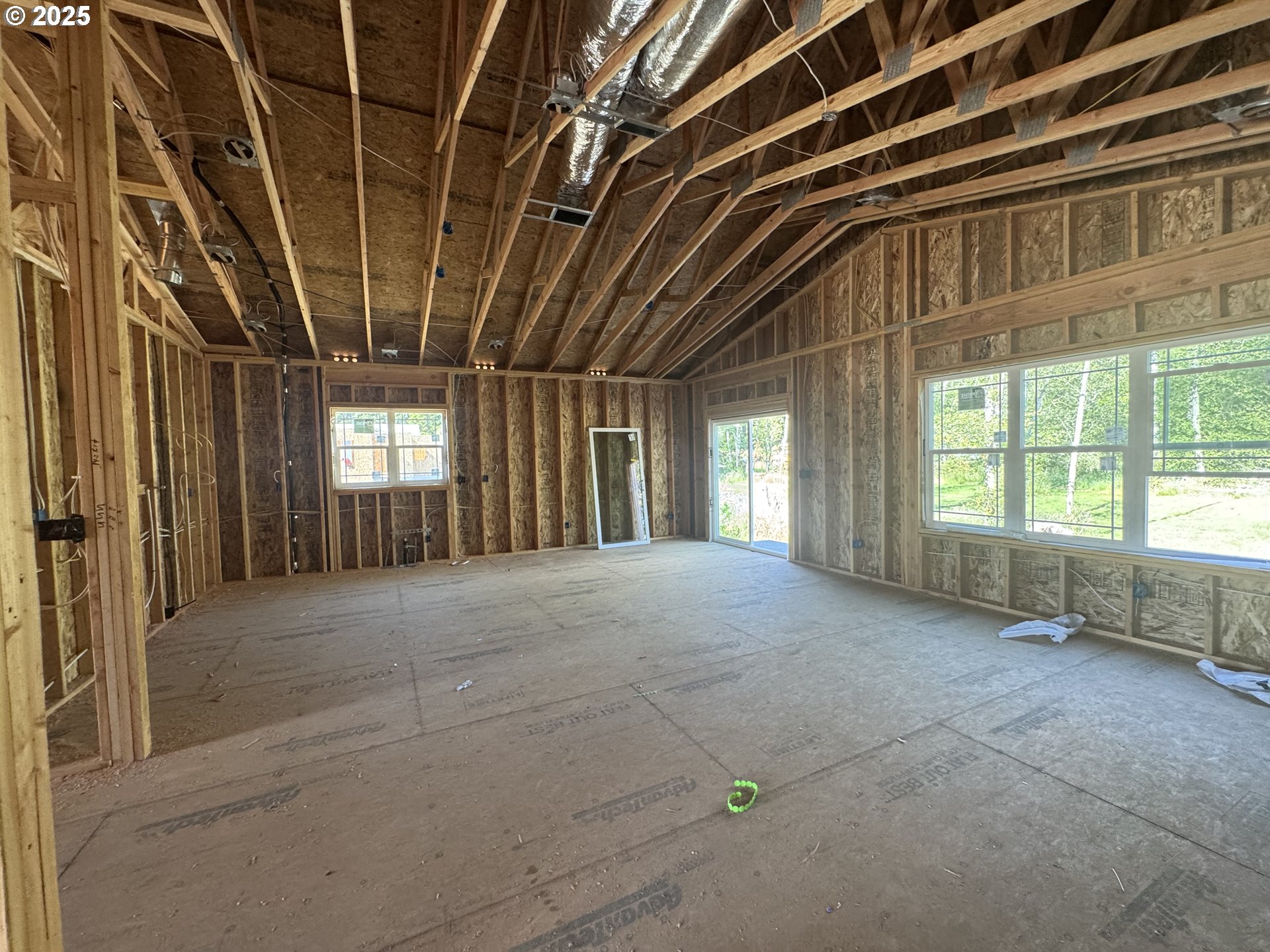1229 Lighthouse Lane Brookings, OR 97415 - Photo 28 of 28 a view of an empty room with a fireplace and windows