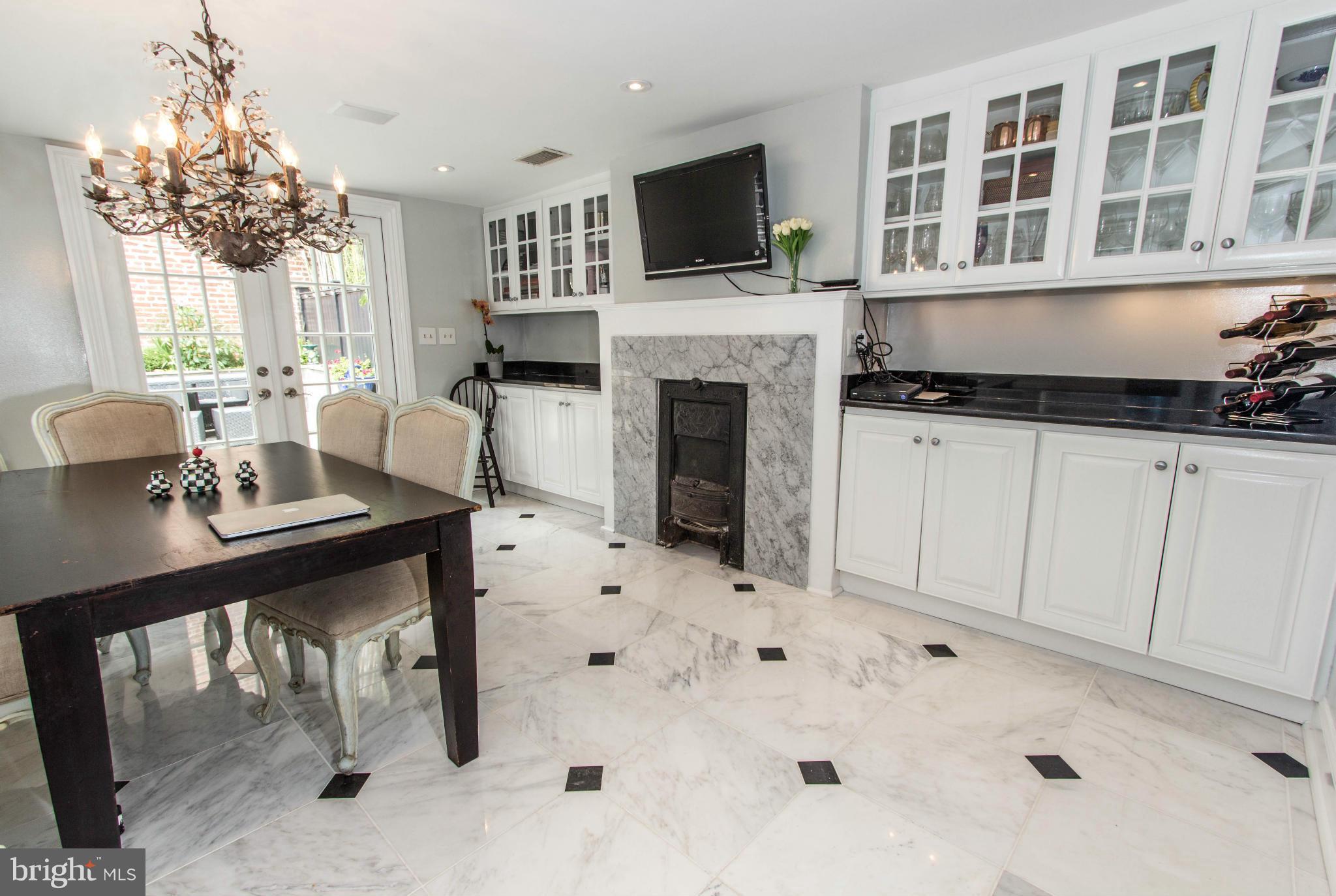 3409 O Street Northwest Washington, DC 20007 - Photo 10 of 30 Hearth Room Leading to Large Private Patio