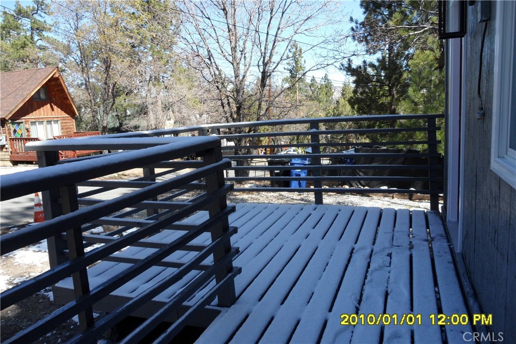 871 Maple Lane Sugarloaf, CA 92386 - Photo 12 of 17 a view of deck with wooden floor and outdoor seating