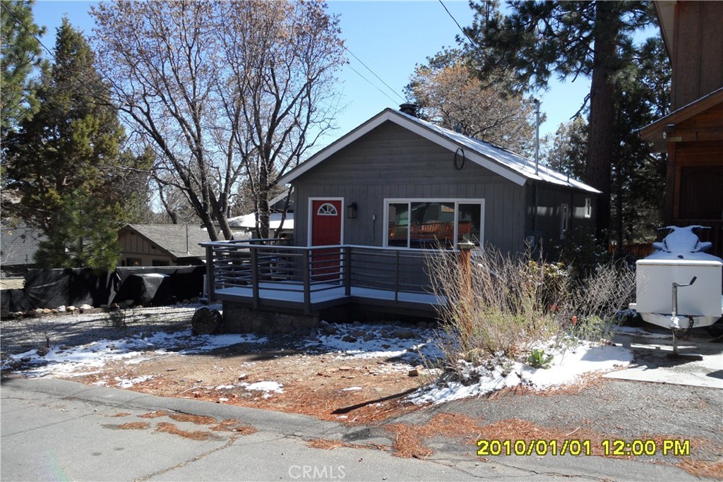 871 Maple Lane Sugarloaf, CA 92386 - Photo 16 of 17 a front view of a house with a yard covered in snow