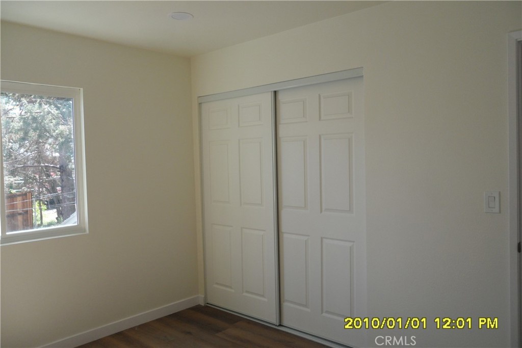 871 Maple Lane Sugarloaf, CA 92386 - Photo 7 of 17 an empty room with windows