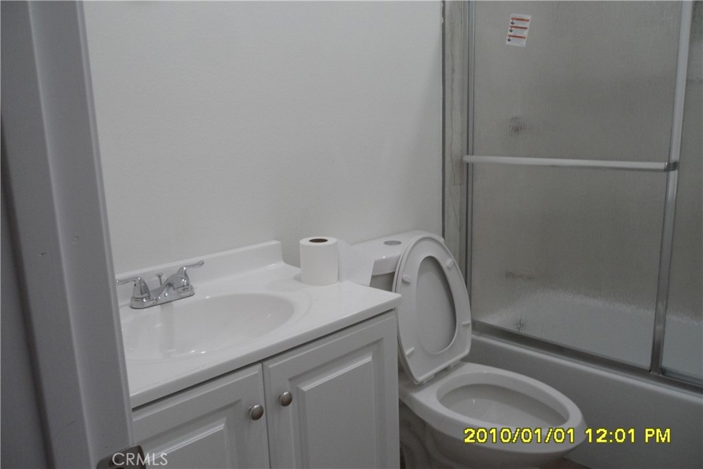 871 Maple Lane Sugarloaf, CA 92386 - Photo 9 of 17 a bathroom with a sink toilet and shower