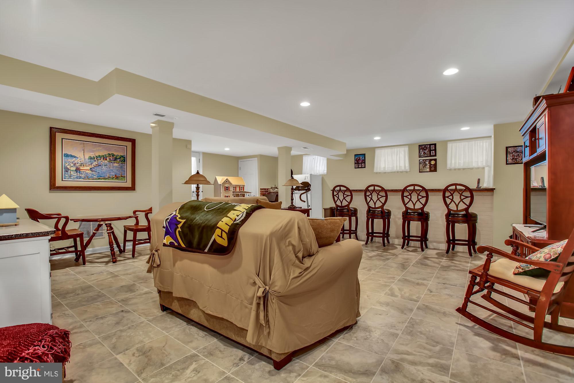 8012 East Riverside Drive Pasadena, MD 21122 - Photo 21 of 38 Gorgeous Updated Basement with Bar and Stools