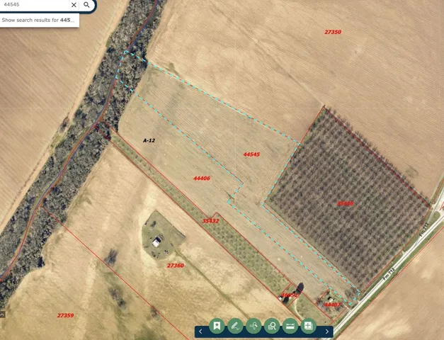 a view of a field with an ocean