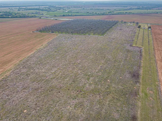 a view of a dry yard with a lake view