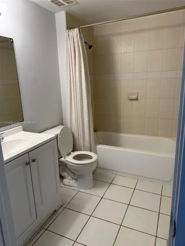 a bathroom with a sink a toilet and a bathtub