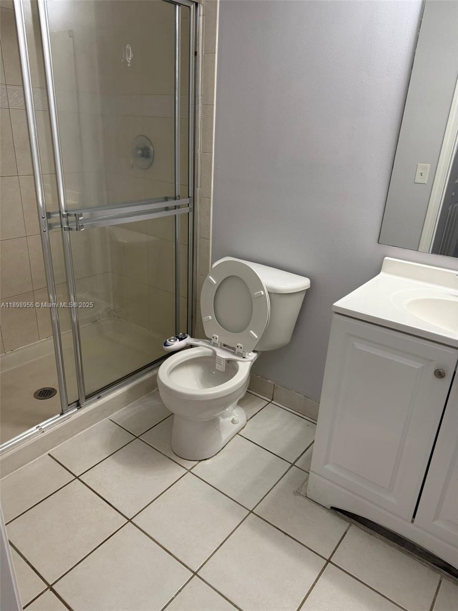 11040 Southwest 196th Street, Unit 211 Cutler Bay, FL 33157 - Photo 7 of 10 a bathroom with a toilet and a shower