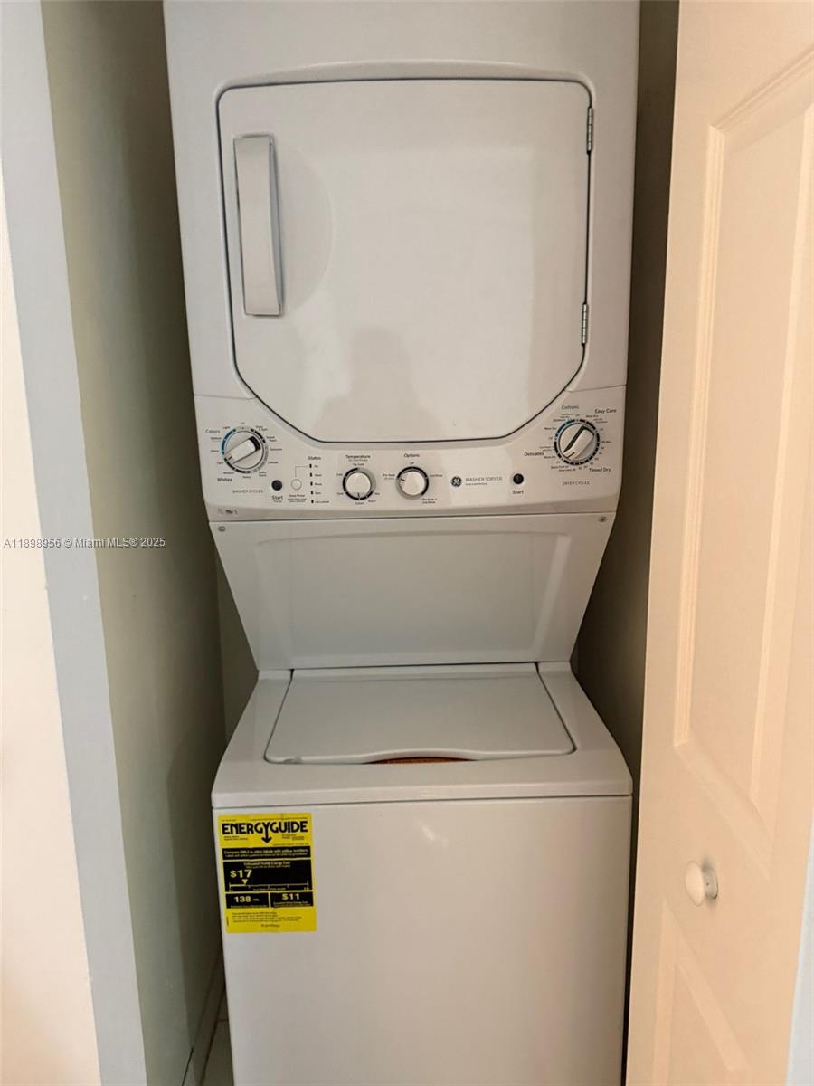 11040 Southwest 196th Street, Unit 211 Cutler Bay, FL 33157 - Photo 8 of 10 a close up view of a washer and dryer