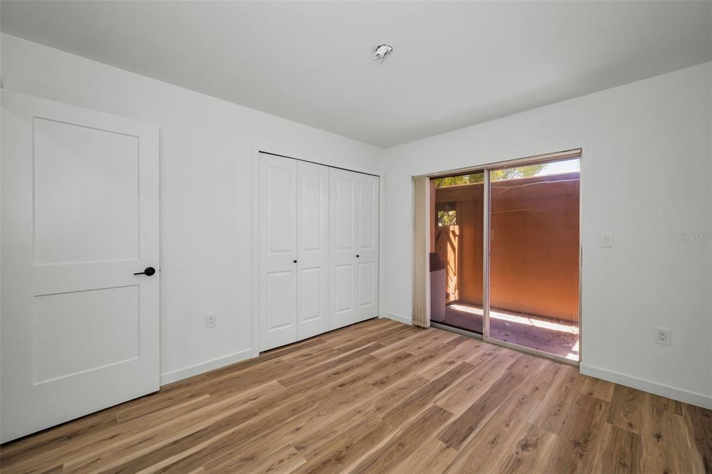 3847 Lighthouse Way, Unit 3847 New Port Richey, FL 34652 - Photo 18 of 89 a view of an empty room with wooden floor and closet