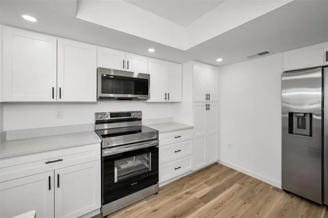 a view of a lake with houses in the background