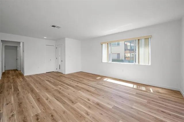 a view of a swimming pool with outdoor seating and a patio