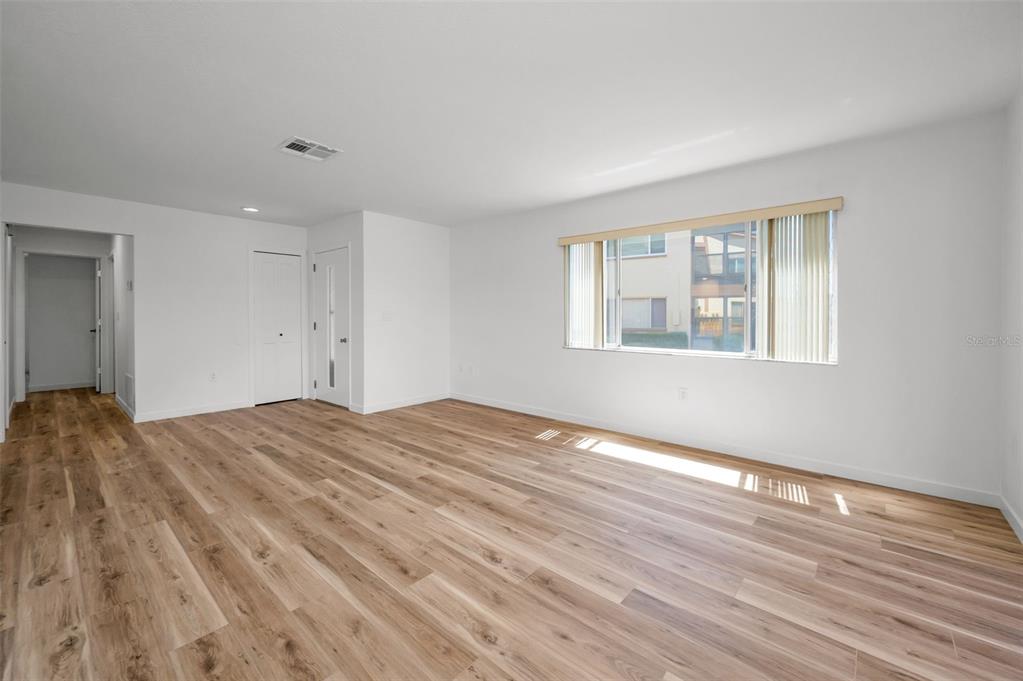 3847 Lighthouse Way, Unit 3847 New Port Richey, FL 34652 - Photo 38 of 89 a view of empty room with wooden floor and fan
