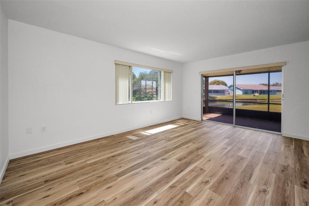 3847 Lighthouse Way, Unit 3847 New Port Richey, FL 34652 - Photo 39 of 89 a view of empty room with wooden floor and fan