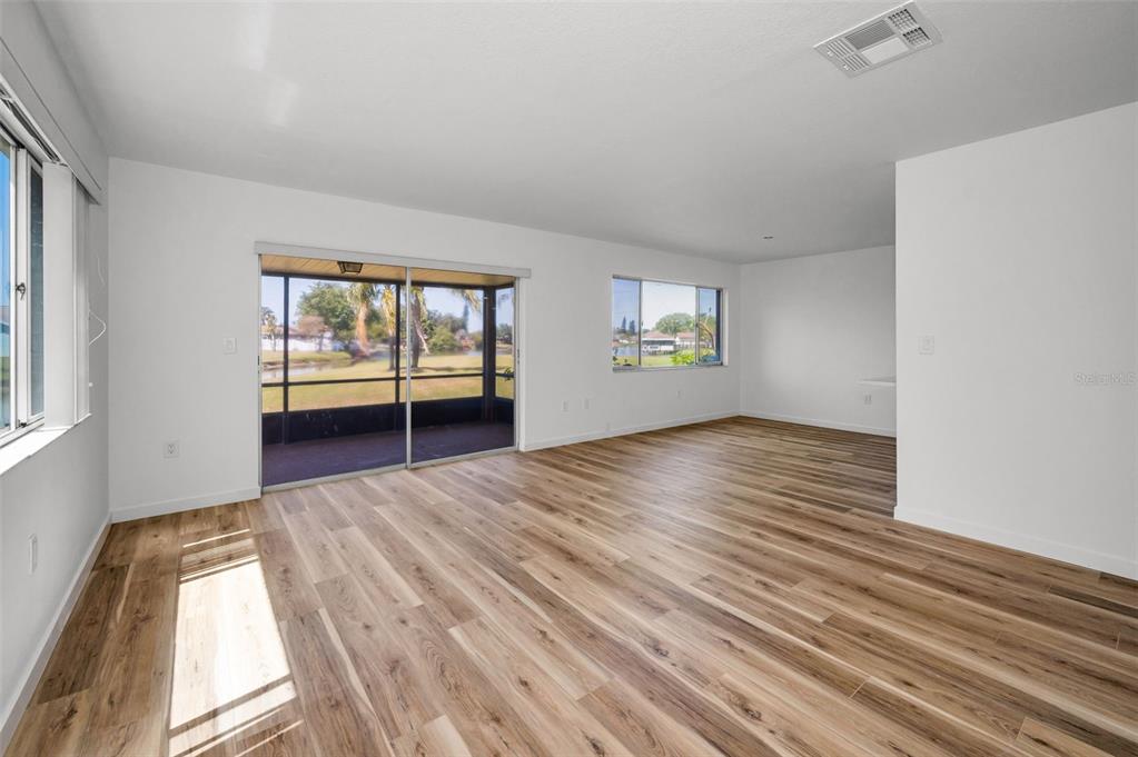 3847 Lighthouse Way, Unit 3847 New Port Richey, FL 34652 - Photo 40 of 89 a view of empty room with wooden floor and fan