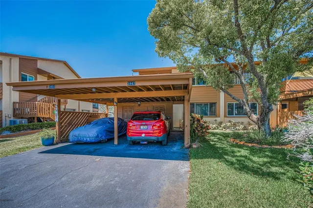 a view of a lake with houses in the background
