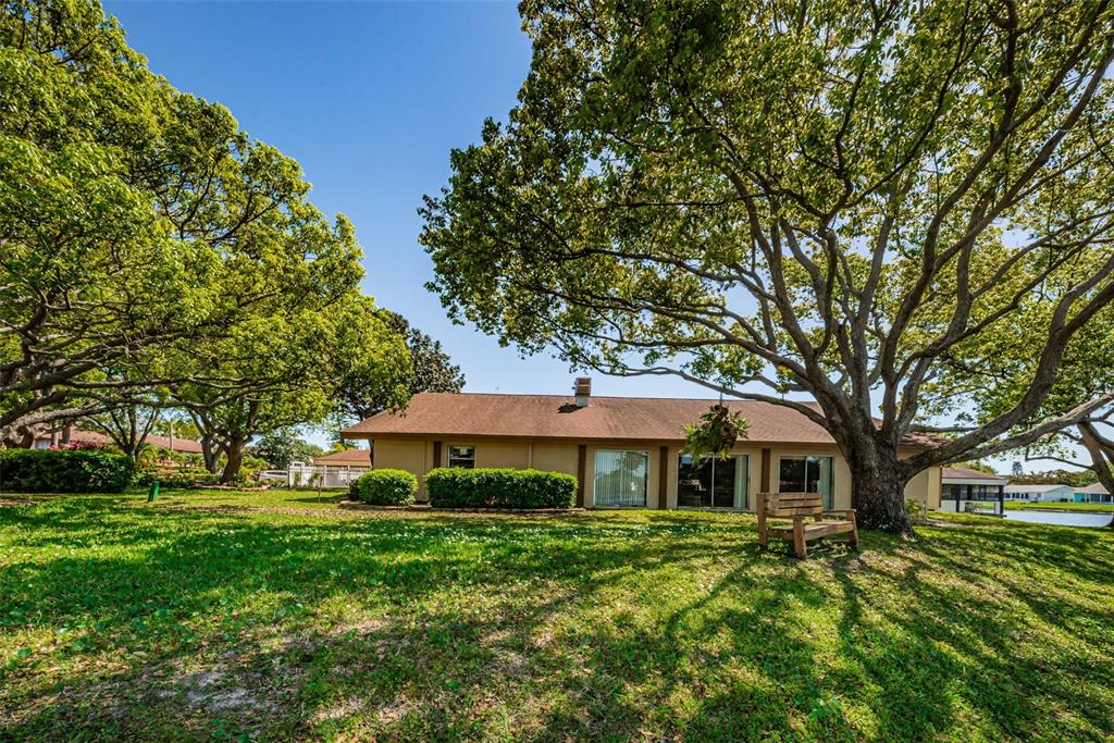 3847 Lighthouse Way, Unit 3847 New Port Richey, FL 34652 - Photo 84 of 89 a front view of a house with a yard