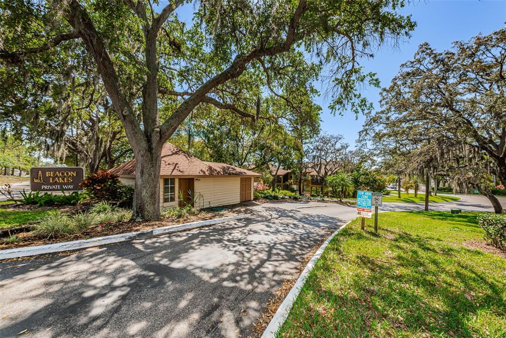 3847 Lighthouse Way, Unit 3847 New Port Richey, FL 34652 - Photo 89 of 89 a view of a backyard with a garden and trees