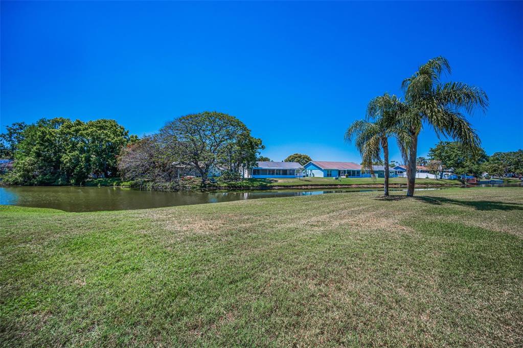 3847 Lighthouse Way, Unit 3847 New Port Richey, FL 34652 - Photo 9 of 89 a view of lake with green space