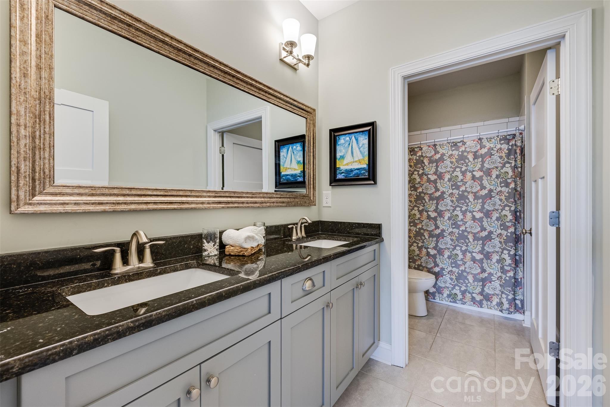 104 Meyers Ridge Road Cramerton, NC 28032 - Photo 18 of 36 a bathroom with a sink a toilet and a mirror