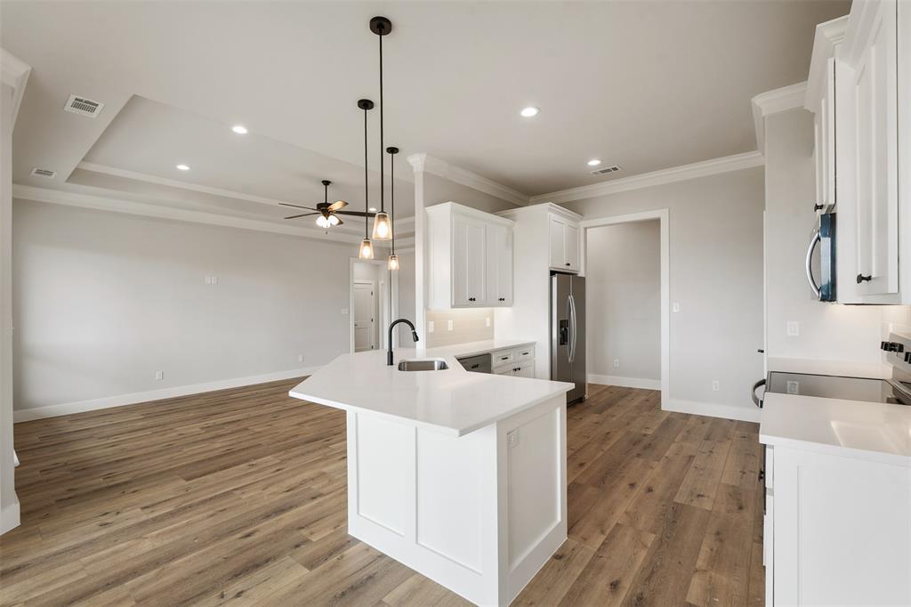 507 Limestone Circle Mabank, TX 75147 - Photo 11 of 36 a kitchen with a sink appliances and cabinets