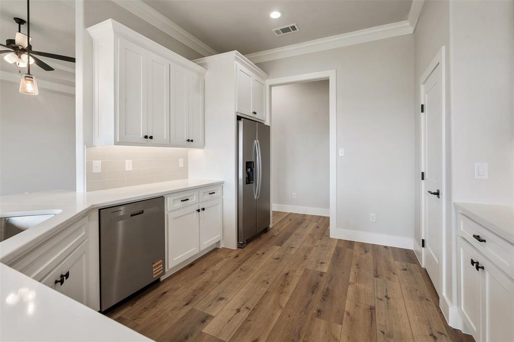 507 Limestone Circle Mabank, TX 75147 - Photo 15 of 36 a view of a kitchen with wooden floor