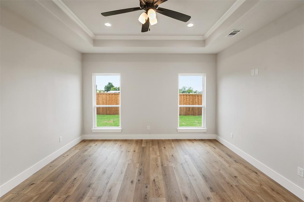 507 Limestone Circle Mabank, TX 75147 - Photo 17 of 36 wooden floor in an empty room with a window
