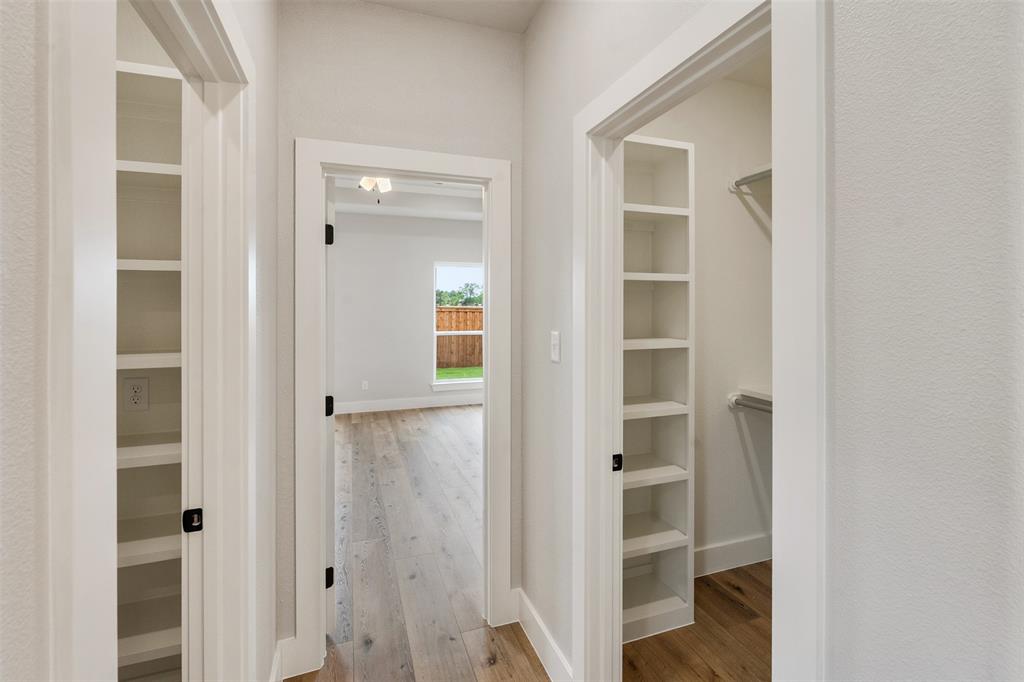 507 Limestone Circle Mabank, TX 75147 - Photo 20 of 36 a view of a hallway with wooden floor and closet