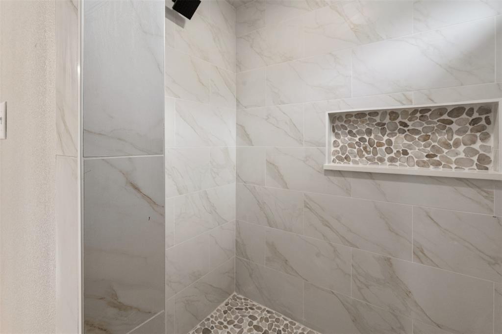 507 Limestone Circle Mabank, TX 75147 - Photo 22 of 36 a bathroom with a shower