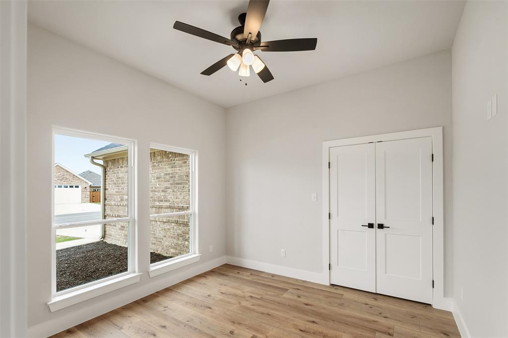 507 Limestone Circle Mabank, TX 75147 - Photo 27 of 36 wooden floor in an empty room with a window