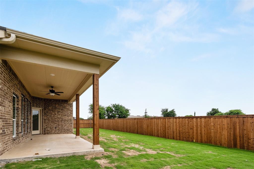 507 Limestone Circle Mabank, TX 75147 - Photo 30 of 36 a view of a backyard with wooden fence