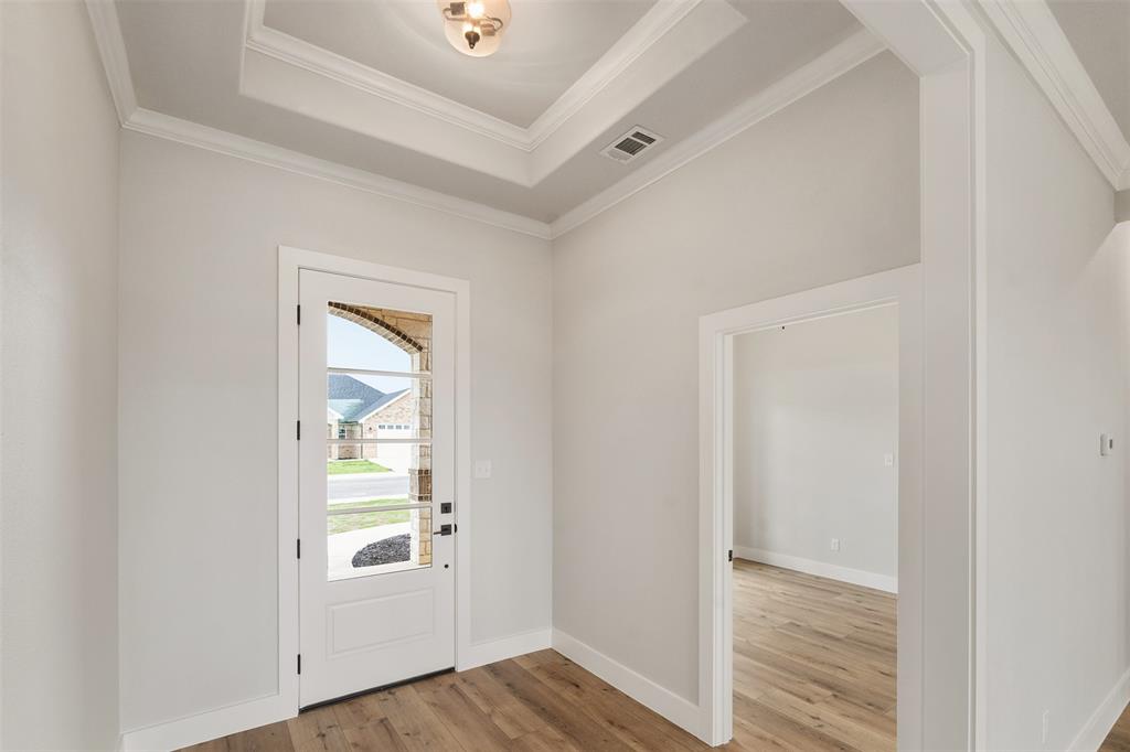 507 Limestone Circle Mabank, TX 75147 - Photo 3 of 36 an empty room with wooden floor closet and windows