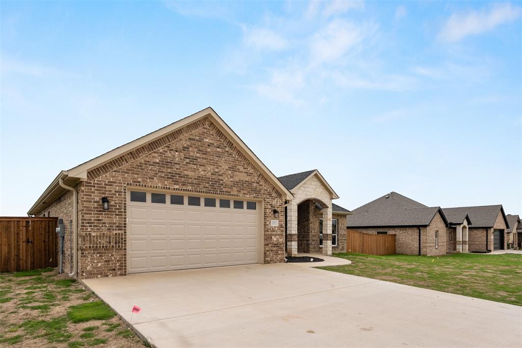 507 Limestone Circle Mabank, TX 75147 - Photo 34 of 36 a view of house with wooden fence next to a road