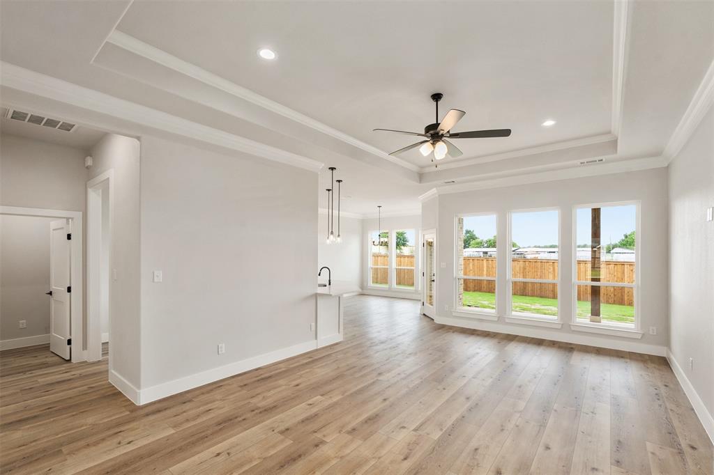 507 Limestone Circle Mabank, TX 75147 - Photo 4 of 36 wooden floor in an empty room with a window