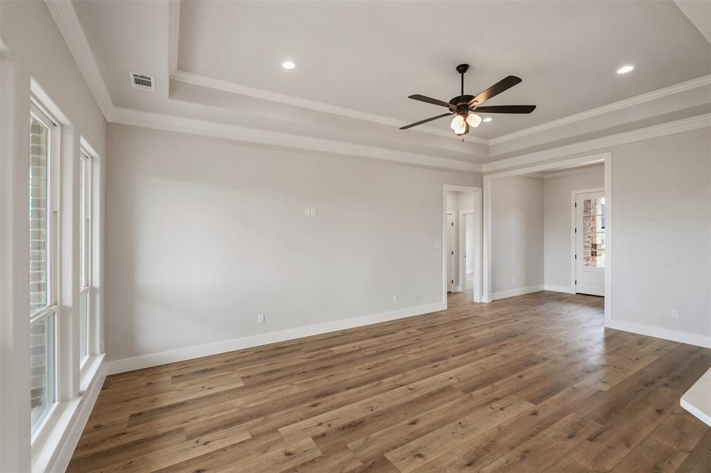 507 Limestone Circle Mabank, TX 75147 - Photo 6 of 36 a view of an empty room with wooden floor and a window