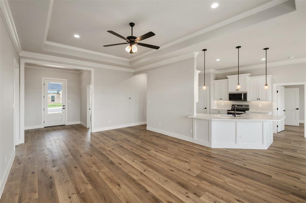 507 Limestone Circle Mabank, TX 75147 - Photo 7 of 36 a view of kitchen with sink microwave and wooden floor