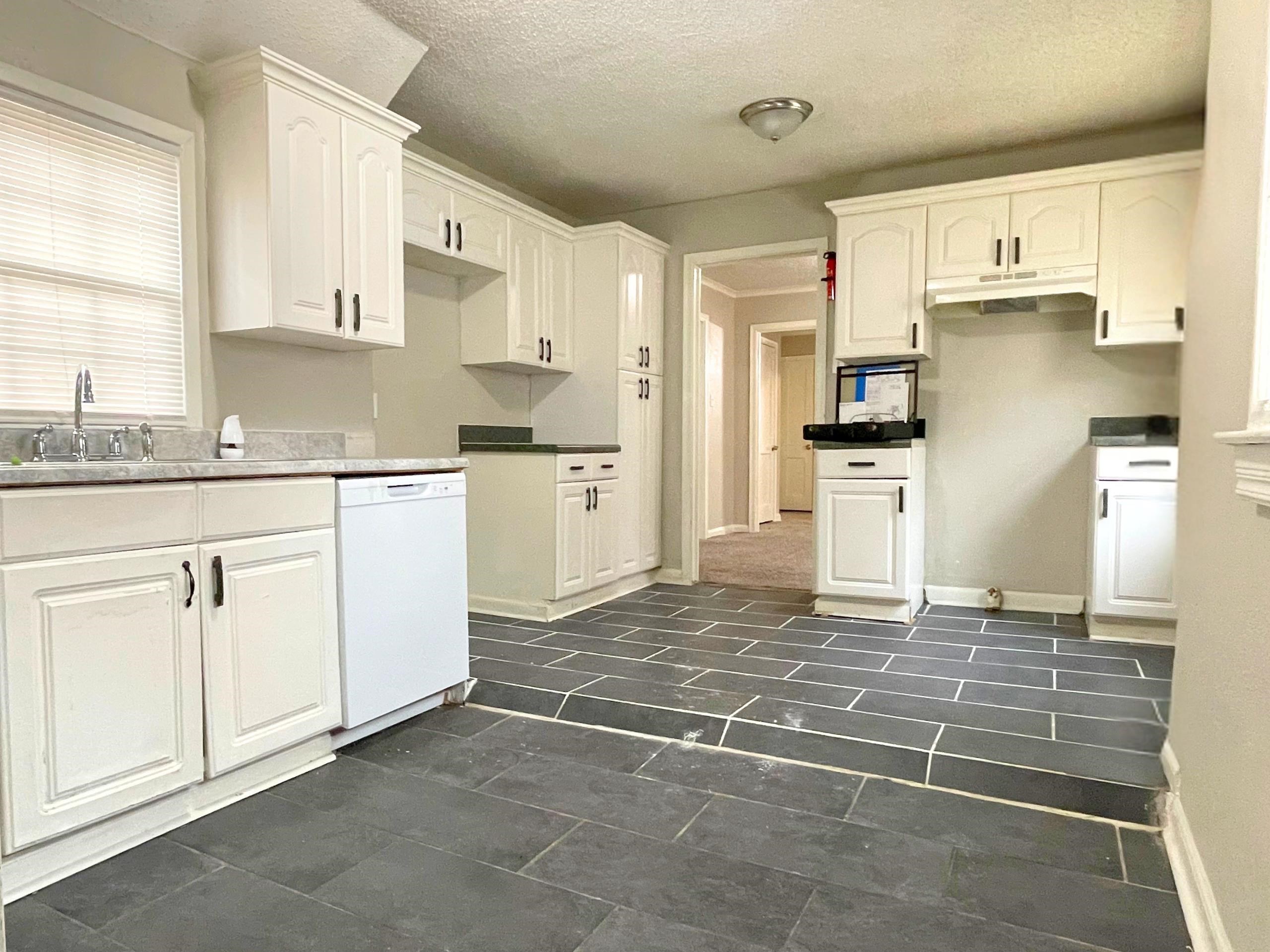 984 East Raines Road Memphis, TN 38116 - Photo 2 of 19 a kitchen with stainless steel appliances a refrigerator sink and cabinets