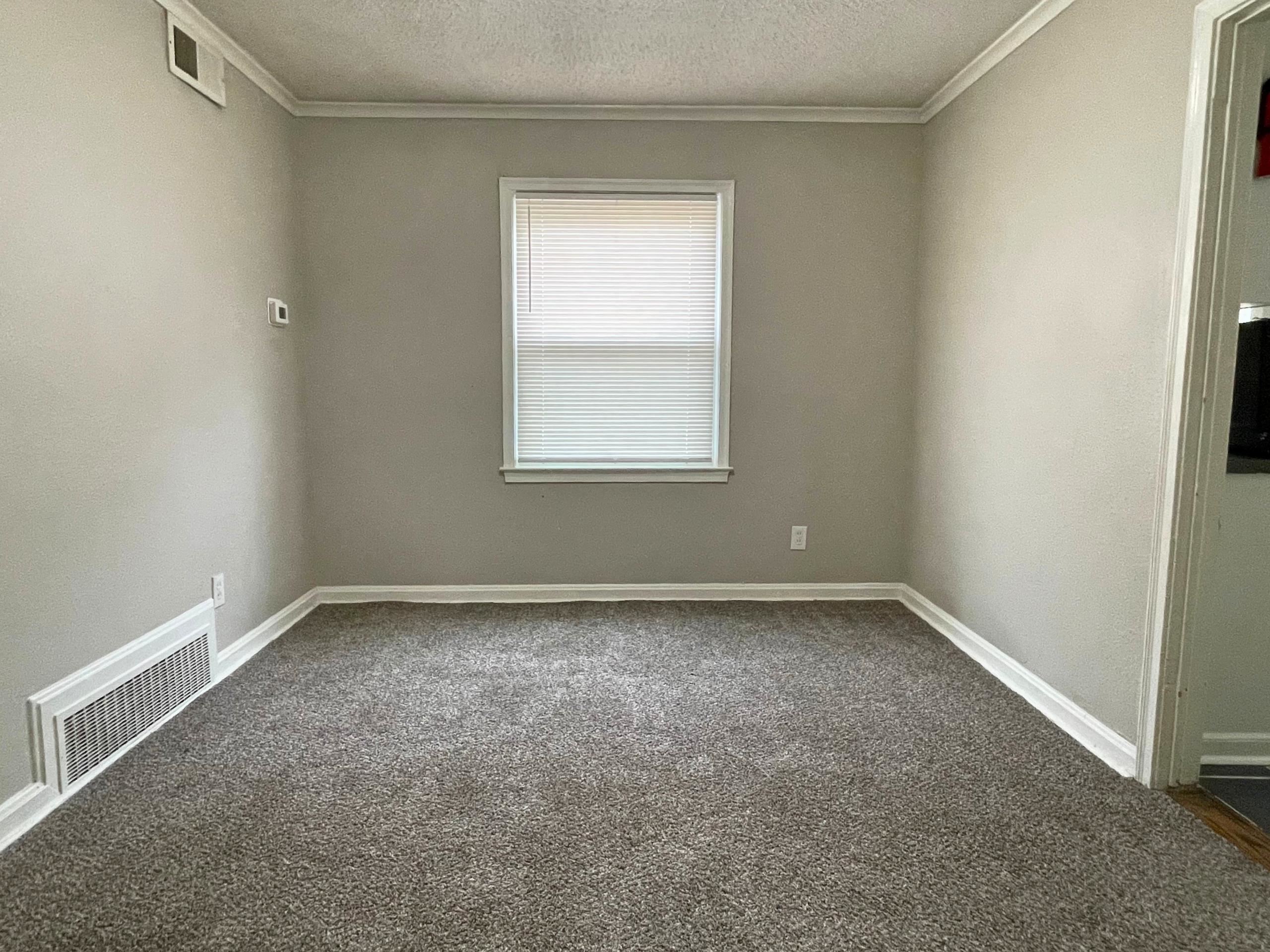 984 East Raines Road Memphis, TN 38116 - Photo 4 of 19 an empty room with a window