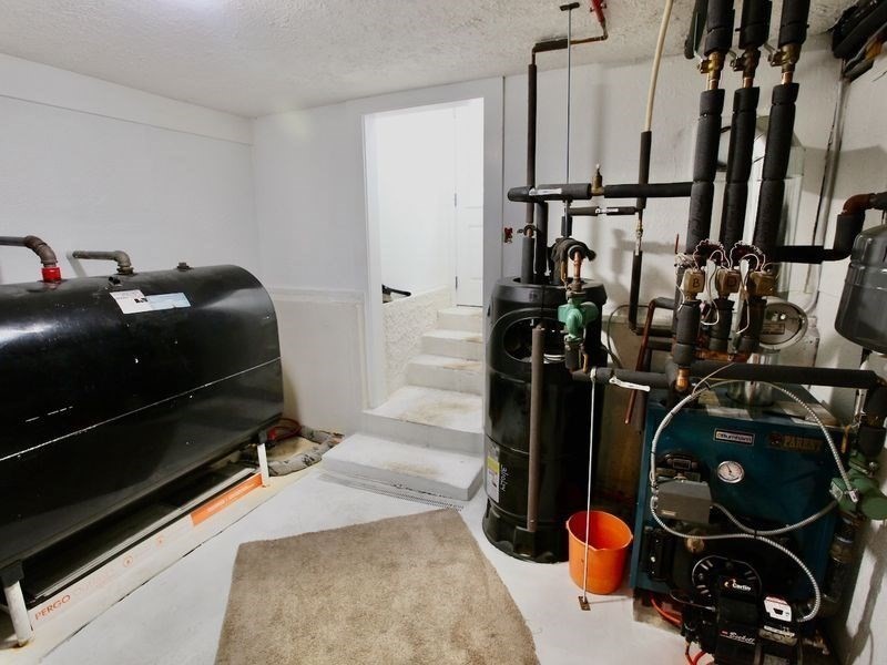 54 Ann Street Raynham, MA 02767 - Photo 17 of 21 a picture of water heater room
