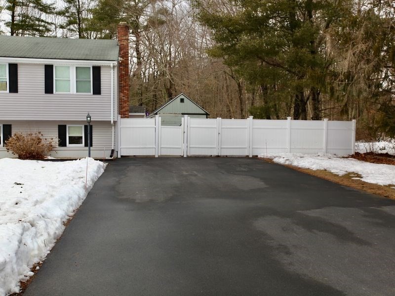 54 Ann Street Raynham, MA 02767 - Photo 3 of 21 a view of white house with snow on the road